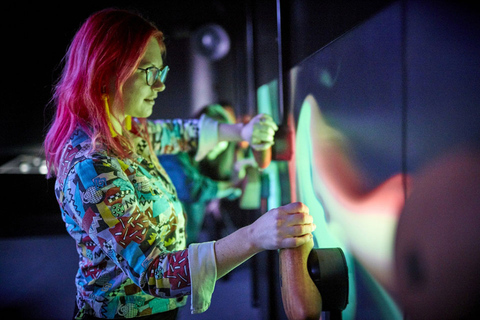 Teens interacting with exhibit at the Scienceworks exhibition 'Beyond Perception'. Photo by Ben Healley.