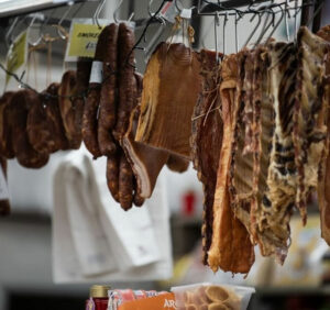 Dried meat hanging in deli at St Albans Market in Brimbank