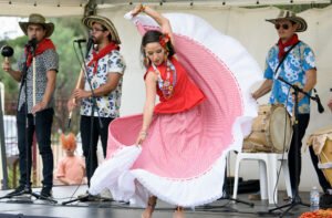 South American band and dancer performing, Melton