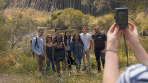 Group of people having their photo taken at Organ Pipes National Park and Dingo Discovery Sanctuary